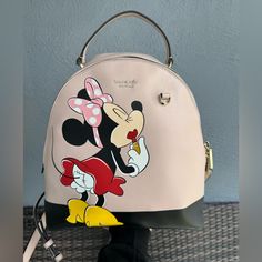 Gently Used Kate Spade Minnie Mouse Backpack Super Cute! Normal Wear, Scrape On Bottom Edge, Clean Inside, Zippers Work Perfectly! Please See Pictures. Questions Please Let Me Know :) Kate Spade Disney Everyday Bag, Kate Spade Disney Style Everyday Bags, Trendy Minnie Mouse Travel Backpack, Trendy Minnie Mouse Backpack For Travel, Minnie Mouse Backpack For Daily Use, Kate Spade Minnie Mouse, Minnie Mouse Backpack, Bags Kate Spade, Kate Spade Bags