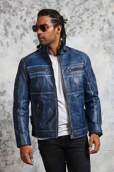 Men's Blue Leather Jacket with Perforation This blue motorcycle jacket is manufactured with finest sheepskin leather, making it soft to touch yet durable. The arresting and distressed style hand-waxed finishing is the key feature that accentuates the look of this blue leather jacket. This biker jacket attributes symmetric zipped closure, 4 spacious zipper pockets on its blue exterior and perforated leather patch on shoulders with lower arm padding. A structured menswear can boost your casual out Blue Biker Leather Jacket For Winter, Fitted Distressed Blue Outerwear, Fitted Blue Distressed Outerwear, Blue Long Sleeve Biker Leather Jacket, Blue Fitted Moto Leather Jacket, Fitted Blue Leather Biker Jacket, Fitted Blue Biker Leather Jacket, Blue Fitted Biker Leather Jacket, Blue Biker Leather Jacket