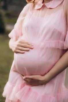 Introducing our stylish and versatile maternity dress. It features a loose and romantic cut, perfect for any occasion. The dress consists of two parts: a combination of an adjustable-strap underdress and a soft tulle overlay adorned with elegant ruffles. It's ideal for baby showers, weddings, or any special event. With its midi length and convenient button closure at the back, it offers both comfort and style. Made from a body-friendly viscose fabric, this dress is designed to be worn during and Gloves Wedding Dress, Dress For Baby Shower, Baby Shower Blue, Maternity Dresses For Baby Shower, Pregnant Wedding Dress, Dress For Baby, Wedding Gloves, Garment Steamer, Baby Shower Dresses