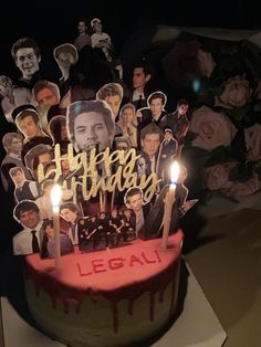 a birthday cake with candles and pictures on it