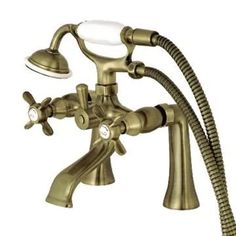 an antique brass faucet with two handset and hose for the shower head