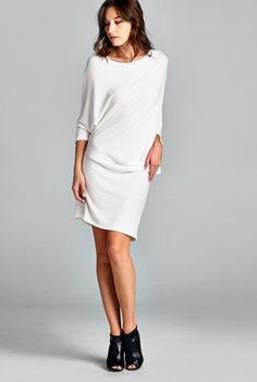 This sophisticated off the shoulder dress is the perfect storm of sexy meets elegant, meets edgy. Why this is in out Top 10 list of wardrobe staples is because its versatility as both a dress and a long top! With 3/4 dolman sleeves and a boatneck, the tunic can be kept as simply dress. Pull it off one shoulder, add some heels and you have a great date dress! Dress has some sheerness and we recommend wearing a nude slip underneath. Only 3 left! Available in off-white. 62% polyester, 33% rayon and Chic Stretch Boat Neck Dress, Spring Evening Dress With Batwing Sleeves, Chic Boat Neck Mini Dress For Spring, Chic Spring Mini Dress With Boat Neck, Spring Boat Neck Dress For Night Out, Party Batwing Sleeve Fall Dresses, Fall Party Dress With Batwing Sleeves, Summer Boat Neck Dress For Night Out, Summer Boat Neck Dresses For Night Out