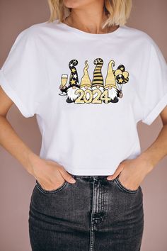 a woman wearing a white t - shirt that says new year's eve on it