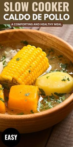 a bowl filled with soup and corn on the cob