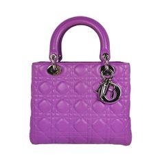 This elegant Dior Lady Dior in size Medium was made of purple quilted lambskin leather. Silver details and the Dior Tag logo complete the look. The Bag features a slightly lowered zipper at the top opening, leather-wrapped handles and a zippered compartment inside. The Bag can be carried comfortably in the hand. A true legend of the French traditional company! Lady Dior Medium, Wallet Chains, Handbag Heaven, Medium Purple, Handbag Wallet, Wallet Accessories, Leather Silver, Beautiful Packaging, Casual Backpack