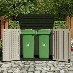 two green trash cans sitting next to each other