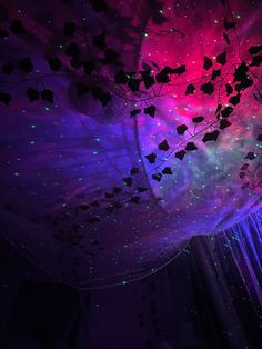 the ceiling is decorated with colorful lights and stars