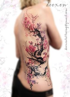 the back of a woman's body with flowers on it