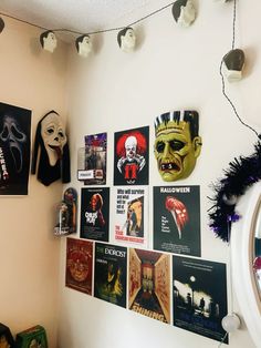 there are many halloween masks on the wall