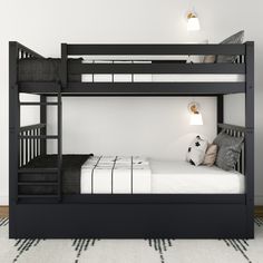 a black bunk bed sitting on top of a white floor