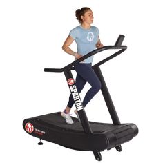 a woman is running on a treadmill