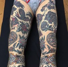 a person with tattoos on their legs and feet