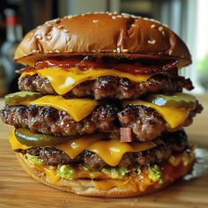 a cheeseburger is stacked on top of another hamburger