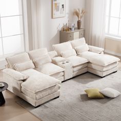 a living room with a sectional couch and pillows