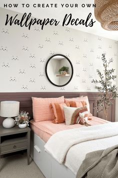 a bedroom with white walls and pink bedspread on the bed is featured in an article about how to create your own wallpaper decals