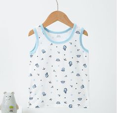 The Cartoon Cotton Tank Top is the perfect addition to your child's summer wardrobe.Crafted with high-quality, breathable cotton fabric, this tank top offers a comfortable and cool fit for boys of all ages. The trendy cartoon design makes it a stylish choice for both casual and active wear.Featuring a sleeveless design and classic fit, this tank top provides excellent freedom of movement, making it perfect for playing sports or running around in the sun.The Cartoon Cotton Tank Top also serve as Cute White Sleeveless T-shirt, Playful White Cotton Tank Top, Cute Sleeveless T-shirt For Playwear, Cute Blue Sleeveless Tank Top, Cute White Tank Top For Playwear, White Cotton Summer Vest, Cartoon Print Tops For Summer Playwear, Summer Cartoon Print Top For Playwear, Cotton Tops With Character Print For Playwear