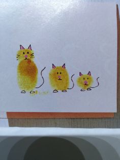 a card with three yellow cats on it