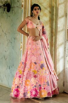 Blush pink lehenga highlighted with heavy multicolored floral embroidery. Comes with off-shoulder chanderi blouse and organza dupatta. 
Component: 3
Embroidered
Neckline: Off-Shoulder
Sleeve Length: Cap
Fabric: Organza, Chanderi
Color: Pink
Embroidered blouse and mirror embellished dupatta
V-hem
Tie-up with tassels at the back
Closure:
Blouse: Hooks at the back - Aza Fashions Langa Designs, Pink Iris, Raw Silk Lehenga, Floral Lehenga, Green Lehenga, Indian Look, Classic Blouses, Pink Lehenga, Embroidered Lehenga