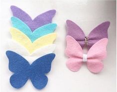 two pieces of felt with butterflies on them