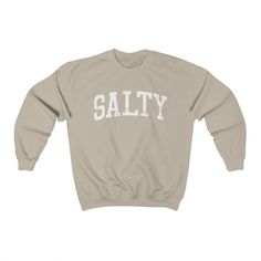 Salty Sweatshirt, Beach Shirt, College Sweatshirts, City Sweatshirt, Unisex Men's and Women's Graphic has a faded, retro appearance. Sweatshirt is a medium-heavy fabric that is soft to the touch. Perfect beach sweatshirt. Size: Runs true to size on women and slightly smaller on men. For a looser fit, please consider sizing up. Fit: Unisex Crewneck Material: 50% Cotton 50% Polyester Shop Little Mountain Clothing Recommended Care: Machine wash: warm (max 40C or 105F) Do not bleach Tumble dry: medi Med Surg Nursing, Aquarius Birthday, Unique Sweatshirt, Dance Mom, Nurse Sweatshirt, Retro Rainbow, Mama Shirts, Cozy Pullover, Mama Sweatshirt