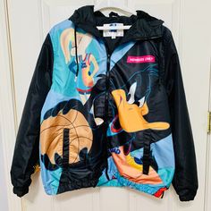 Members Only X Looney Tunes Space Jam Squad Windbreaker Light Jacket With Hoodie Product Details: 100% Polyester (Shell And Lining) Closure: Zip Pit-To-Pit: 23" Shoulder-To-Hem: 25.5" Arm Length: 26" Size: Medium *** Lay Flat Measurement Looney Tunes Space Jam, Members Only Jacket, Space Jam, Looney Tunes, Light Jacket, Colorful Hoodies, Hoodie Jacket, Vest Jacket, Blue Black