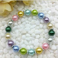 Pink, Blue, Green, Yellow, Purple, White And Silver Beaded Stretch Bracelet. Stretch Bracelets Diy, Stretch Beaded Bracelets Diy, Homemade Bracelets, Diy Jewelry Rings, Fun Bracelet, Kids Bracelets, Beads Bracelet Design, Bracelet Diy, Beaded Bracelets Diy