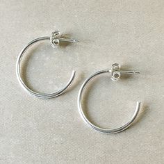 Simple and classic. Lightweight, dainty hoops to wear anywhere and everywhere. Simple Everyday Hoop Huggie Earrings, Adjustable Classic Hoop Earrings In Sterling Silver, Simple Small Hoop Everyday Jewelry, Adjustable Classic Sterling Silver Hoop Earrings, Classic Adjustable Sterling Silver Hoop Earrings, Simple Sterling Silver Hoop Earrings For Everyday, Adjustable Classic Hoop Earrings, Classic Small Hoop Jewelry For Everyday, Simple Small Hoop Earrings For Pierced Ears