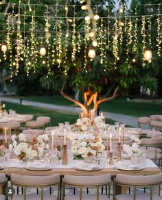 the tables are set with candles, plates and place settings for an elegant dinner party