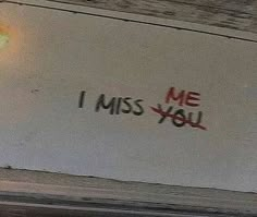 graffiti on the side of a building that says, i miss you written in red