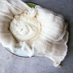 a bowl filled with whipped cream on top of a table