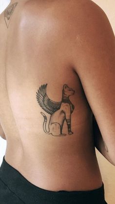 a person with a dog tattoo on their back