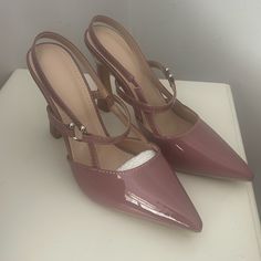 These Mauve Pink Heels Are Perfect For Dress Or With Pants. 3 1/2’ Heel In Size (40-8 1/2 Us) With Elastic Stretch Slip On With Decorative Silver Hook. Fit Like A Little Loose 8 1/2. My Mom Purchased Them On Line And They Were Too Big For Her. Patient Look Man Made Material. New Never Used Without Tags. Purple High Heel Slingback Pumps For Summer, Purple High Heel Slingback Pumps For Spring, Chic Purple Slingback Heels, Purple High Heel Slingback Pumps With Heel Strap, Purple High Heel Slingback Pumps, Spring Purple Slingback Pumps With Heel Strap, Purple Slingback Pumps For Spring, Chic Purple Slingback Pumps With Ankle Strap, Purple High Heel Slingback Pumps For Formal Occasions