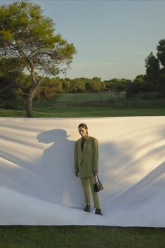 a man standing in front of a white sheet