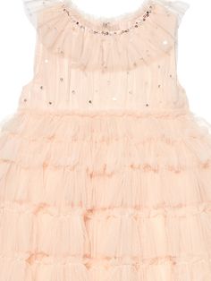 Introducing the elegance of our Mural Tulle Dress in Pale Coral. This tiered dress tells a story of sophistication and sweet charm. Sequins, crystals and pearls delicately cascade across the bodice, while the ruffled neck line creates a vision of beauty. Elevate your little one's wardrobe with this timeless piece. Shipping and Returns This product can be returned/exchanged within 20 days of receiving the item. All orders are dispatched from our Sydney, Australia warehouse. SHIPPING EST. TIMEFRAM Fitted Sleeveless Tulle Holiday Dress, Elegant Embellished Tutu Dress For Dress-up, Elegant Sleeveless Tutu Dress For Festive Occasions, Elegant Tulle Holiday Dress For Festive Occasions, Sleeveless Ruffled Holiday Dress For Wedding, Sleeveless Ruffled Holiday Wedding Dress, Elegant Summer Holiday Dress-up Dress, Festive Pink Tulle Dresses, Elegant Pink Sleeveless Holiday Dress