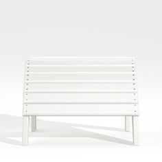 a white bench sitting on top of a white floor