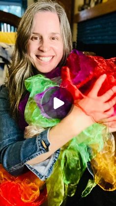 a woman holding a stuffed animal in her arms