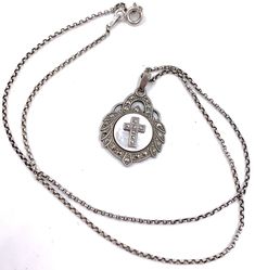 "Vintage Art Deco 925 Sterling Silver Marcasite Mother of Pearl Shell Cross Pendant Necklace. Such sparkle and shine! Fabulous little marcasite studded cross mounted on a center round mother of pearl shell disc within an embellished circle of shiny marcasites. The cross pendant hangs on an 17 1/2\" long sterling silver rolo chain.    The back of the pendant is marked sterling, chain is marked .925 Italy. The necklace chain measures 17 1/2\" long.  Pendant measures 1 \" high by 3/4\" wide. Weighs 5.9 grams. Very Good vintage condition. Nice aged patina. All marcasites intact without damage. I will send this beautiful necklace in a gift box. Perfect for Easter, First Holy Communion, Baptism, Birthday or even Mother's Day." Antique Sterling Silver Cross Pendant Necklace, Vintage Silver Engraved Cross Necklace, Vintage Silver Sterling Silver Cross Necklace, Vintage Sterling Silver Cross Necklace, Antique Silver Cross Necklace Gift, Vintage Engraved Silver Cross Necklace, Vintage Sterling Silver Cross Necklace Gift, Antique Silver Cross Necklace As Gift, Antique Silver Cross Necklace For Gift