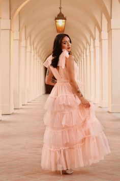 The Eliza is a more formal take on the classic puff dress. Be the belle of the ball with tiered ruffle layers, adjustable tulle bows and a smocked waist. This is the perfect occasion dress.Hana is wearing a size Small. She is 5’4” with a 32C bust and 25” waist. Tulle Ruffle Prom Dress, Pink Tulle Bridesmaid Dress, Prom Dresses With Bows, Pink Puff Dress, Tulle Dress Photoshoot, Puffy Tulle Dress, 90's Prom, Feminine Esthetics, Tulle Tiered Dress