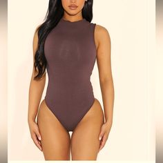 Naked Wardrobe Size Small Chocolate Brown Sleeveless Bodysuit. Cute Mock Neck Detail And Double Snap At Bottom. I Have 2 Size Smalls And They Both Have Some Discoloration Throughout. Some At The Bottom And Some On The Front Middle Area. Brown Sleeveless Bodysuit, Sleeveless Brown Bodysuit For Summer, Brown Sleeveless Bodysuit For Summer, Sleeveless Brown Summer Bodysuit, Wardrobe Brown, Naked Wardrobe, Sleeveless Bodysuit, Chocolate Brown, Mock Neck