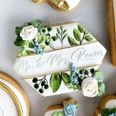 decorated cookies and cookie cutters on a table