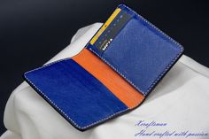 This wallet is unique, you will never see the exact same thing. The exterior alligator leather is cut along its scale's edge to show an orange layer below. The orange line is unique because the texture of the alligator is unique. The wallet opens vibrantly with blue and orange color inside. I've tried my best to put my unique technique and my passion into this small piece. Every single wallet is made to order, there won't be a second same thing. If you are looking for a small accessory but it's Luxury Blue Card Holder As Gift, Luxury Blue Card Holder For Gift, Luxury Blue Card Holder Gift, Blue Leather Business Card Holder, Blue Leather Card Holder With Interior Slots, Blue Leather Card Holder For Formal Use, Blue Bifold Card Holder For Formal Occasions, Luxury Blue Leather Card Holder, Blue Business Card Holder With Interior Slots