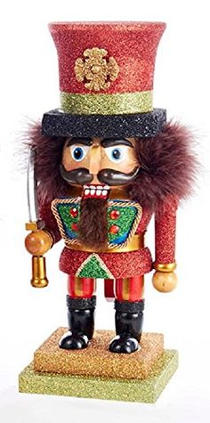 a nutcracker figurine with a red hat and fur on it's head