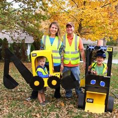 a family dressed up as construction workers posing for a photo