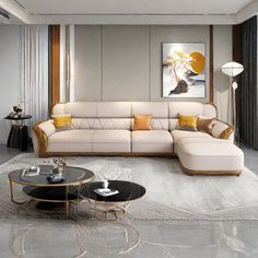 a modern living room with white and gold furniture