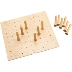 wooden peg board with six pegs and five holes for the pegboard to be placed on