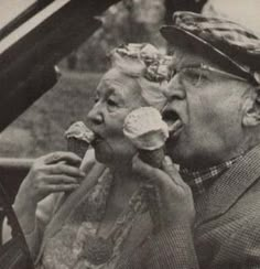 an old man and woman eating ice cream while sitting in a convertible car with the caption, forever young at heart