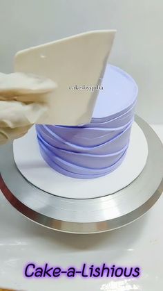 a stack of white plates sitting on top of a metal plate with a spatula