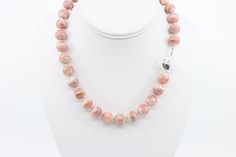 This large gemstone statement necklace is handcrafted with round 12mm all natural AA+ Argentinian pink rhodochrosite beads, highlighted with sterling silver findings and finished with a large handcrafted sterling silver toggle clasp. The rhodochrosite gemstones display lacey striations of pink hues from light soft pink to rich raspberry pink, with minimal dark banding. If you love rhodochrosite, the color pink and want to stand out from the crowd then this statement piece is for you!   The pink Pink Opal Round Beads Necklace For Gift, Pink Opal Gemstone Necklace, Artisan Pink Jewelry With Round Beads, Single Strand Pink Opal Necklace With Round Beads, Pink Opal Round Beads For Jewelry Making, Pink Opal Round Beads Jewelry, Pink Round Artisan Jewelry, Pink Agate Jewelry With 8mm Beads, Artisan Pink Gemstone Beads Jewelry