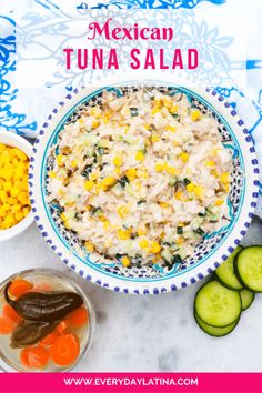 mexican tuna salad in a blue and white bowl with cucumbers, carrots, celery on the side