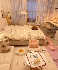 a living room filled with lots of furniture and decor on top of a white rug